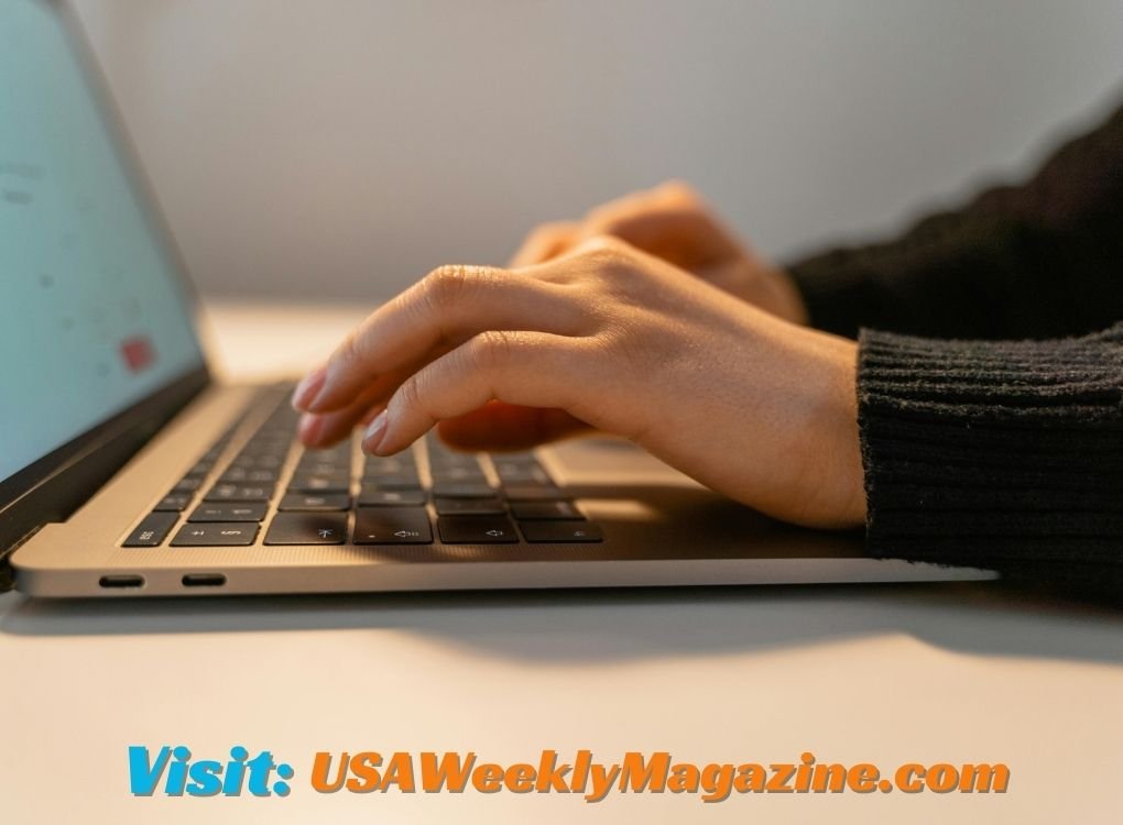 Close-up of hands typing on a laptop, searching for Beverly Hills Los Angeles zip code